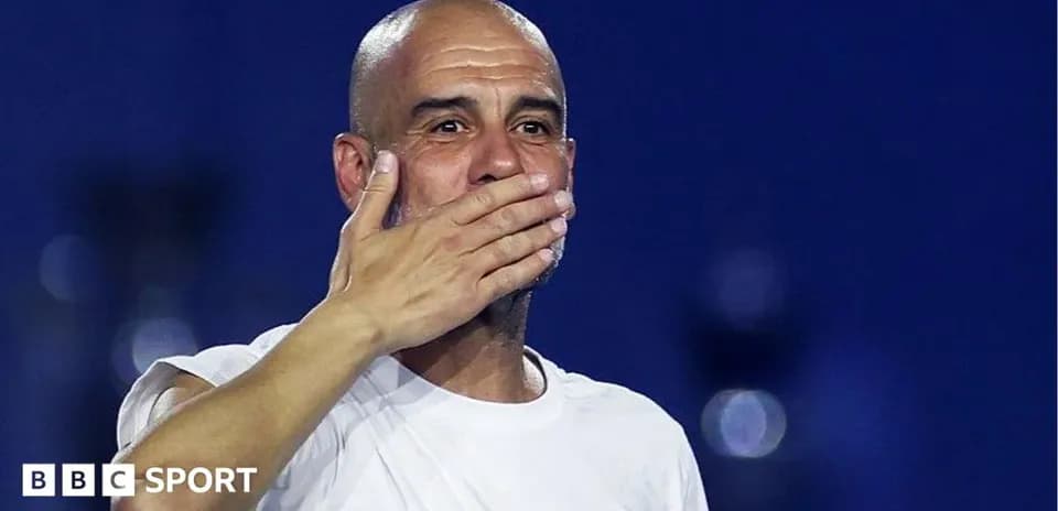 Manager gesturing during post-match celebration