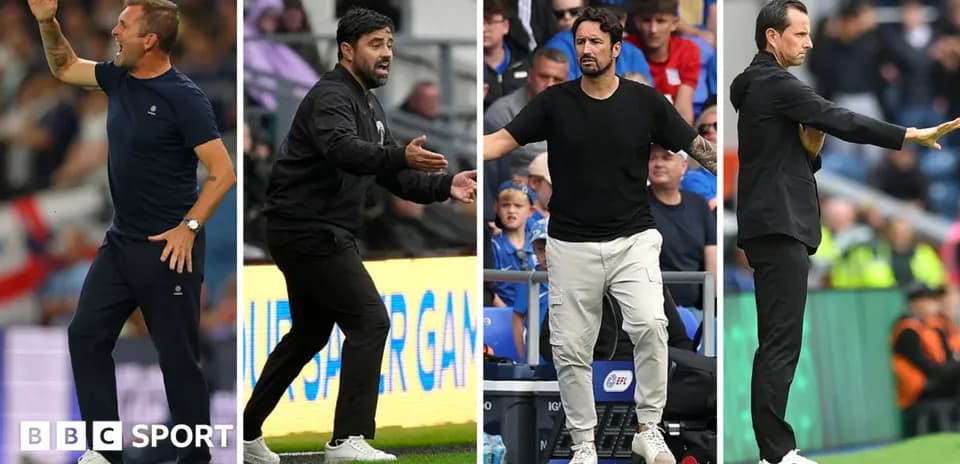 Four football managers giving instructions during match