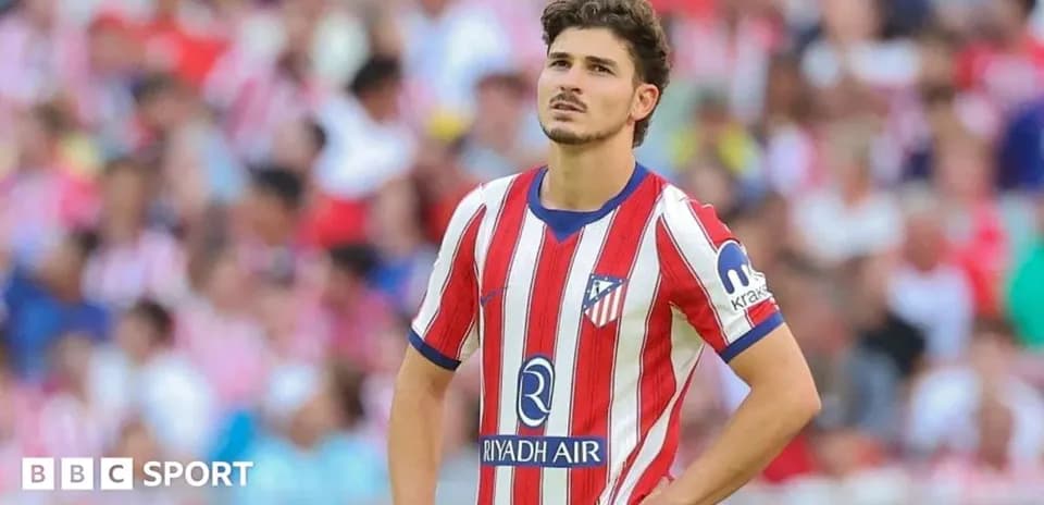 Atletico Madrid player looking concerned on field