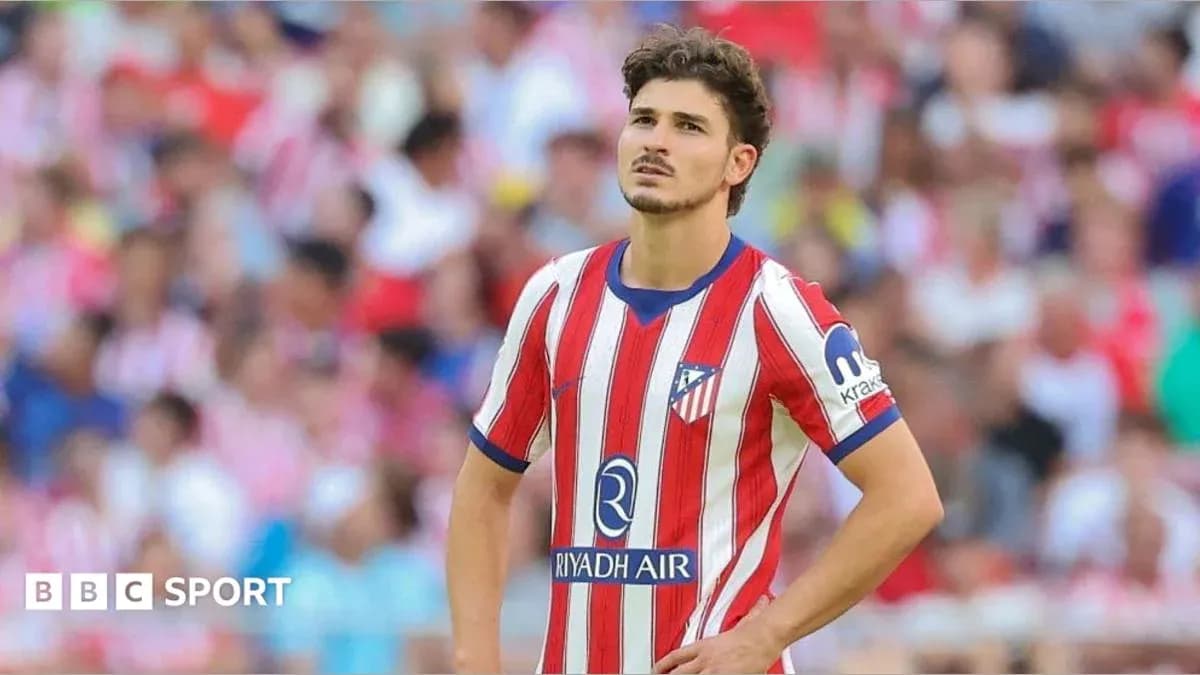 Atletico Madrid player looking concerned on field