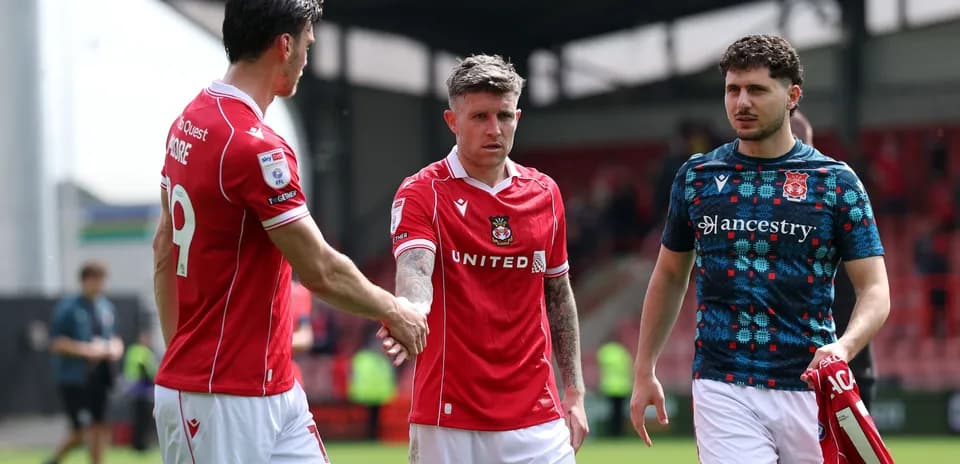 Wrexham players shaking hands after the match
