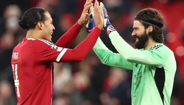 Players celebrating with high-five after match