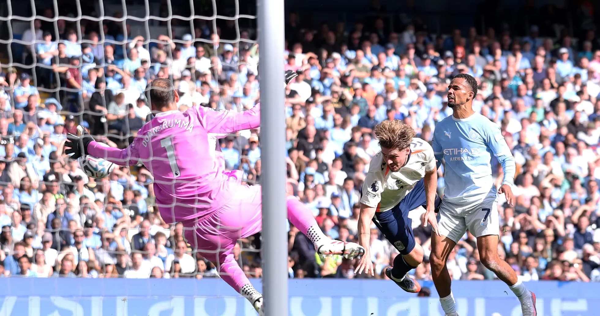 Goalkeeper saving a shot during a football match