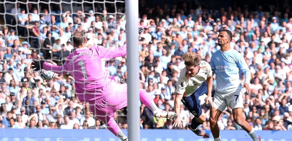 Goalkeeper saving a shot during a football match