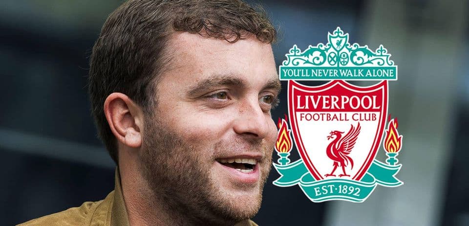 Adam Lallana smiling with Liverpool logo in background