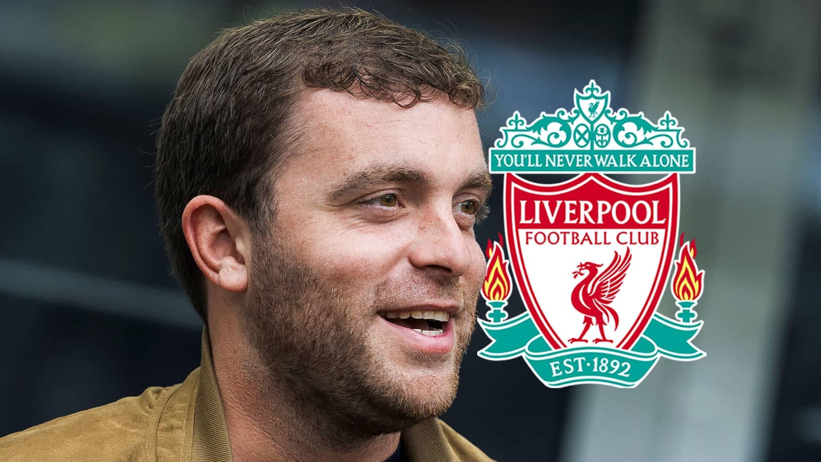 Adam Lallana smiling with Liverpool logo in background