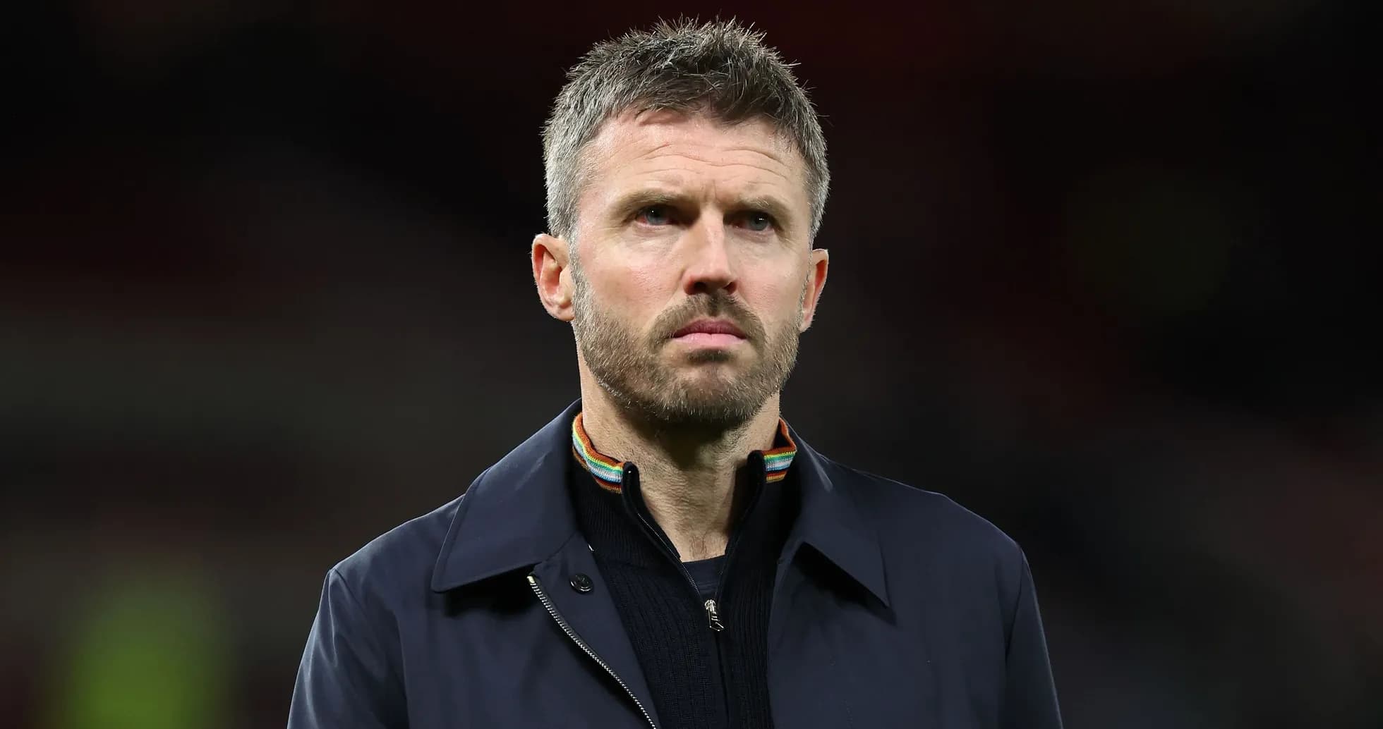 Coach standing on the sidelines during a match