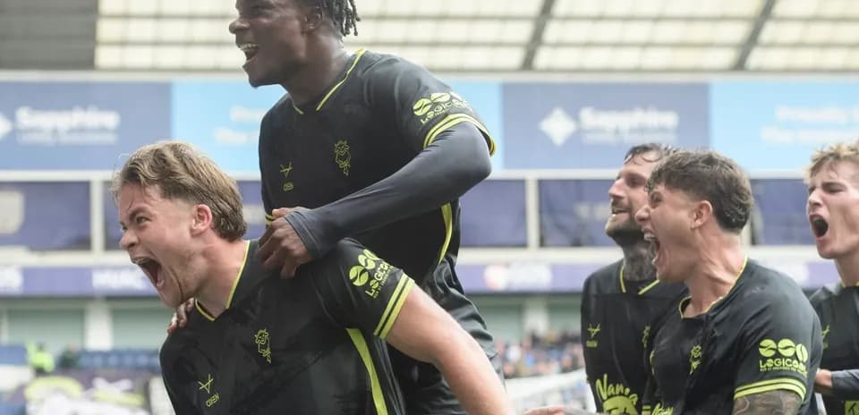 Players celebrating a goal during a football match