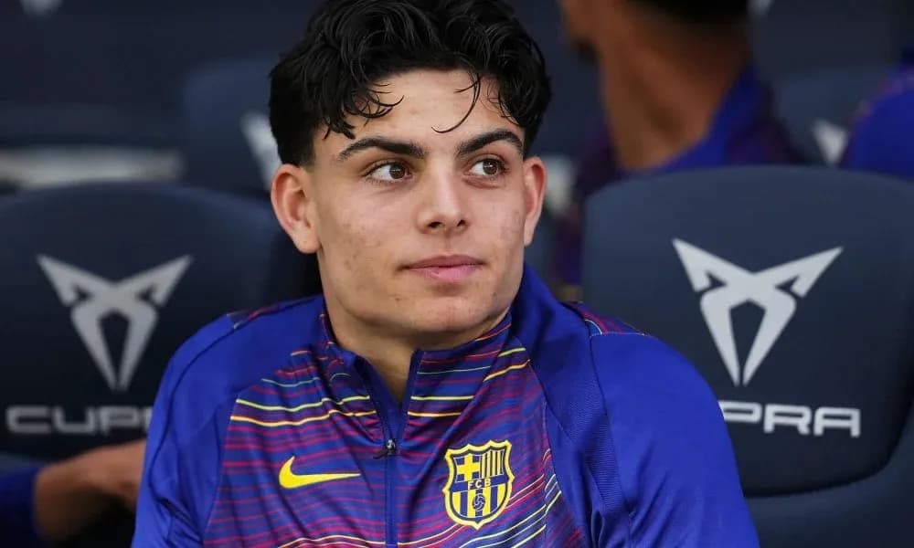 Barcelona player sitting on the bench during match