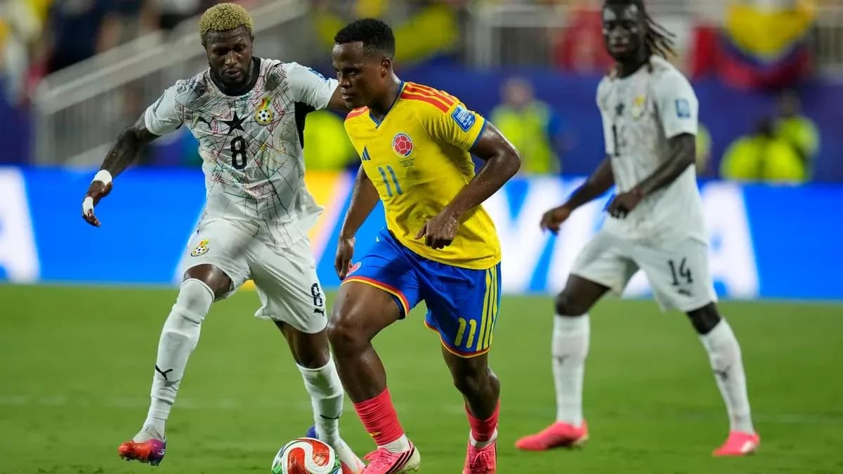 Colombian player dribbling past Ghanaian defender during match
