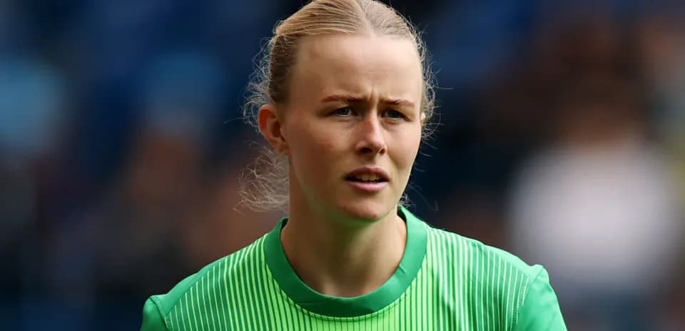 Goalkeeper wearing green jersey during match