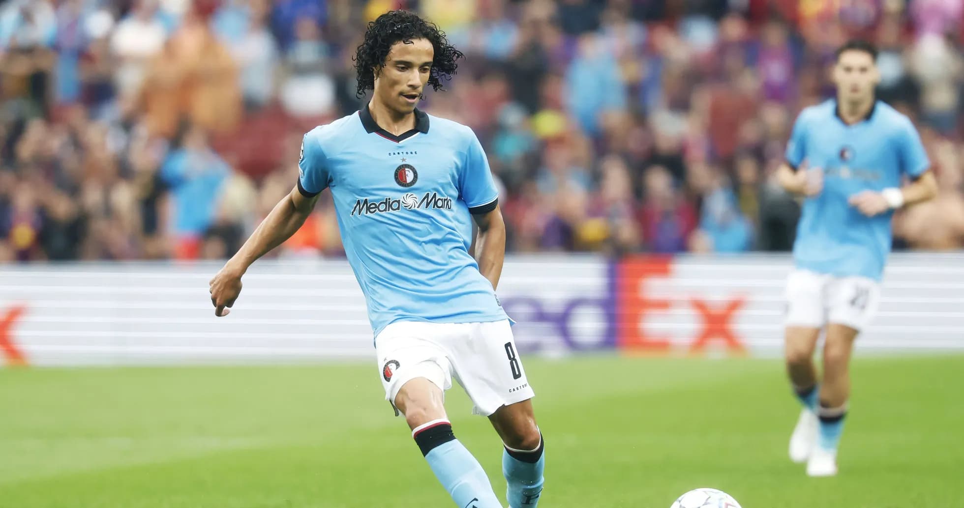 Feyenoord player dribbling ball during match