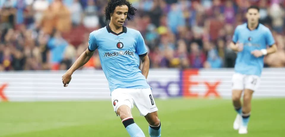 Feyenoord player dribbling ball during match