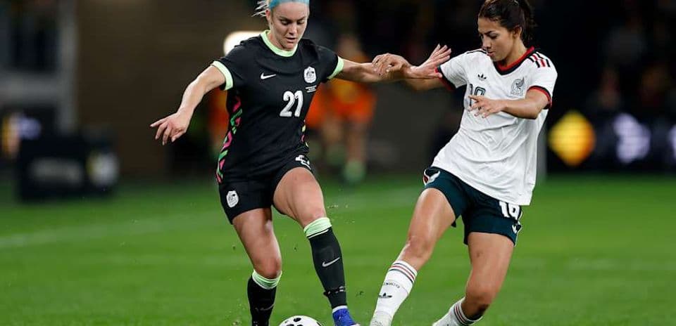 Two players competing for the ball during match