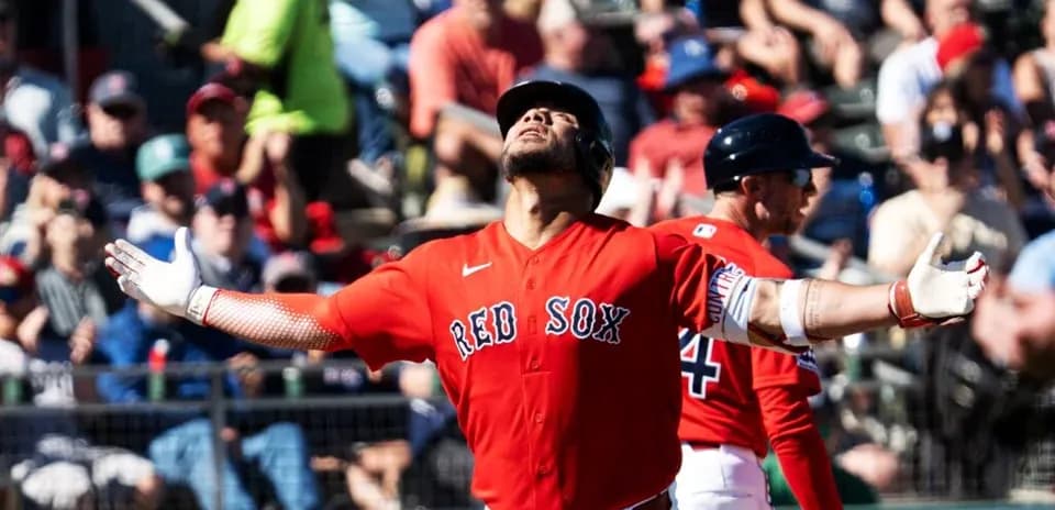 Red Sox player celebrating in front of fans