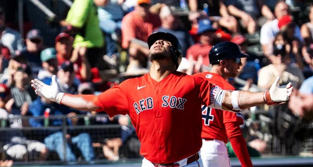 Red Sox player celebrating in front of fans