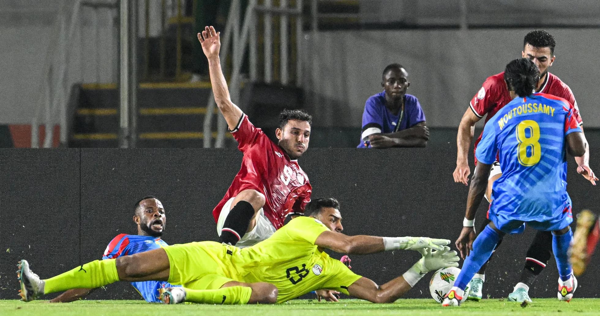 Players contesting for the ball near goal line