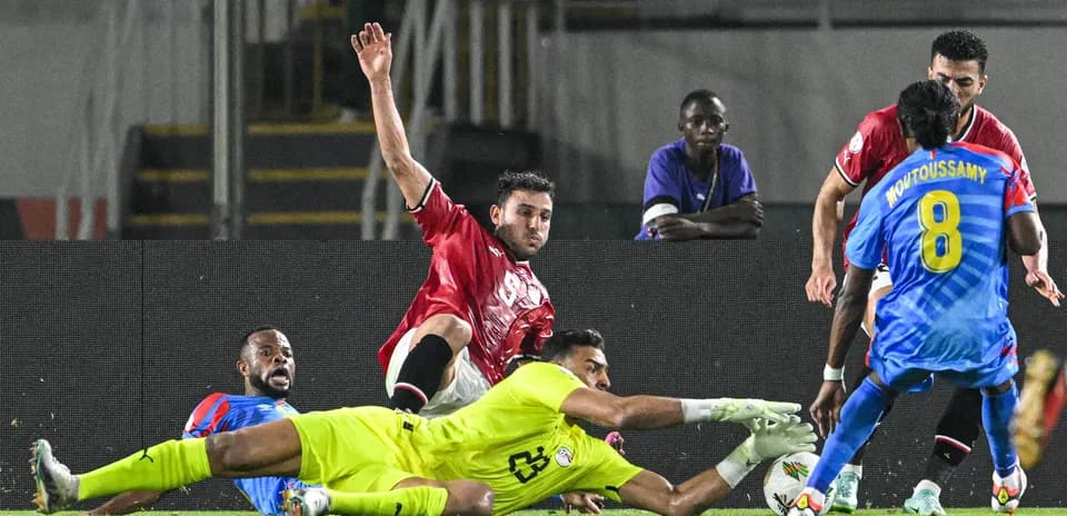 Players contesting for the ball near goal line