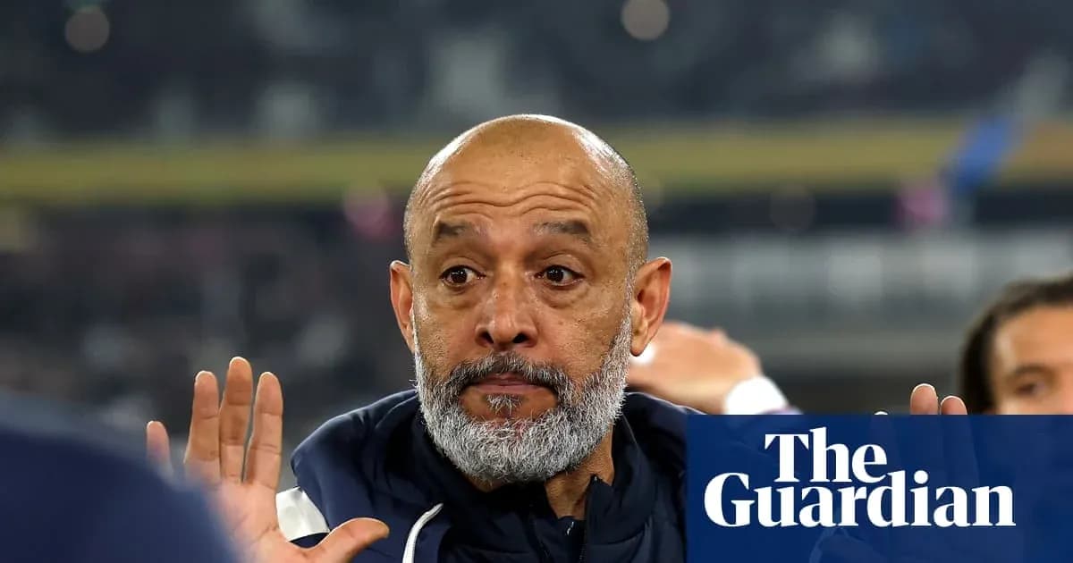Men's football coach gesturing during match