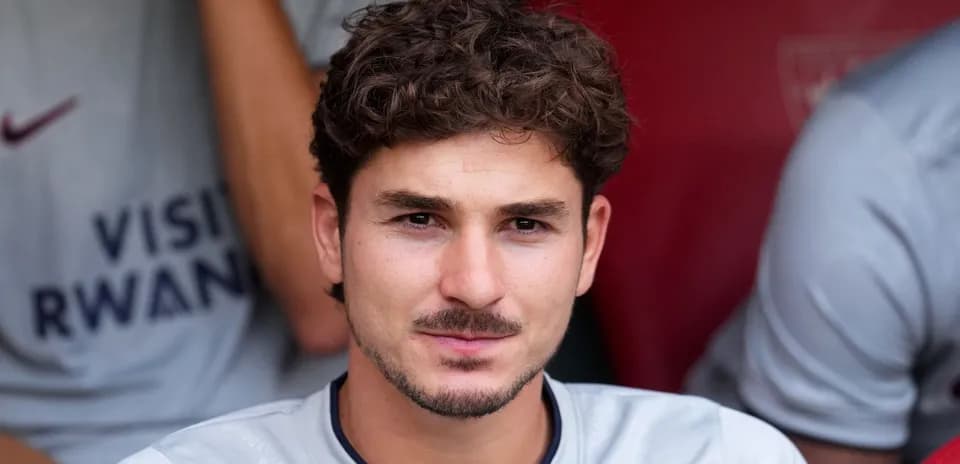 Player sitting on bench during match