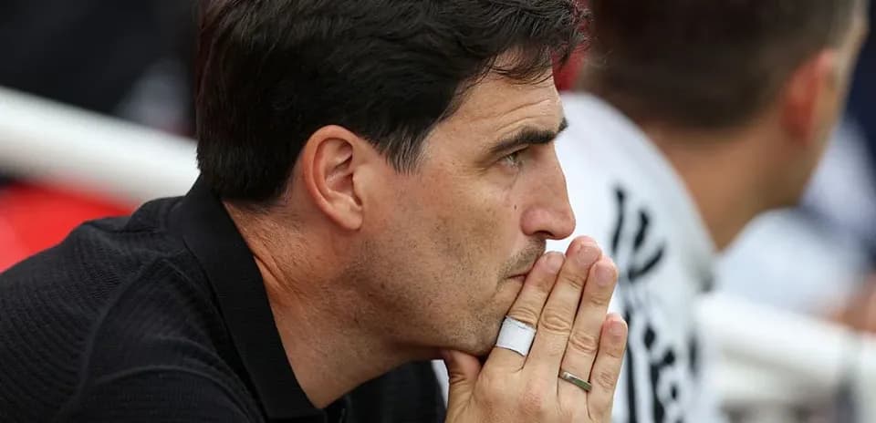 Coach observing the match from the sidelines