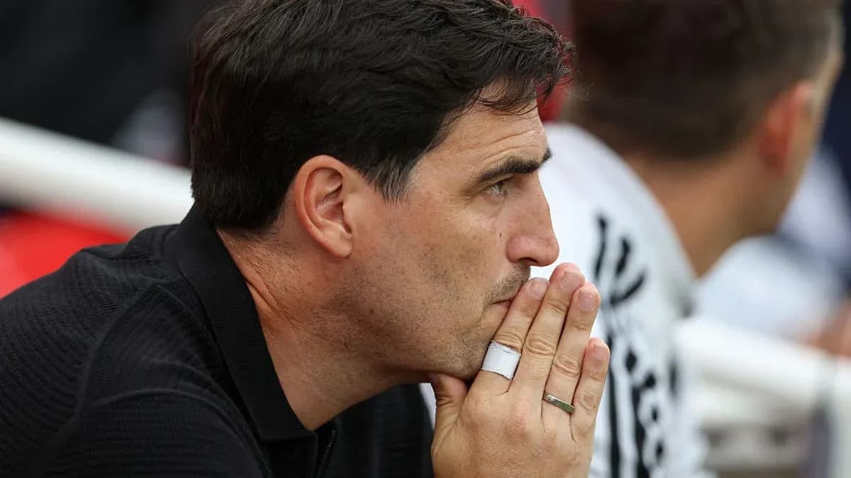 Coach observing the match from the sidelines