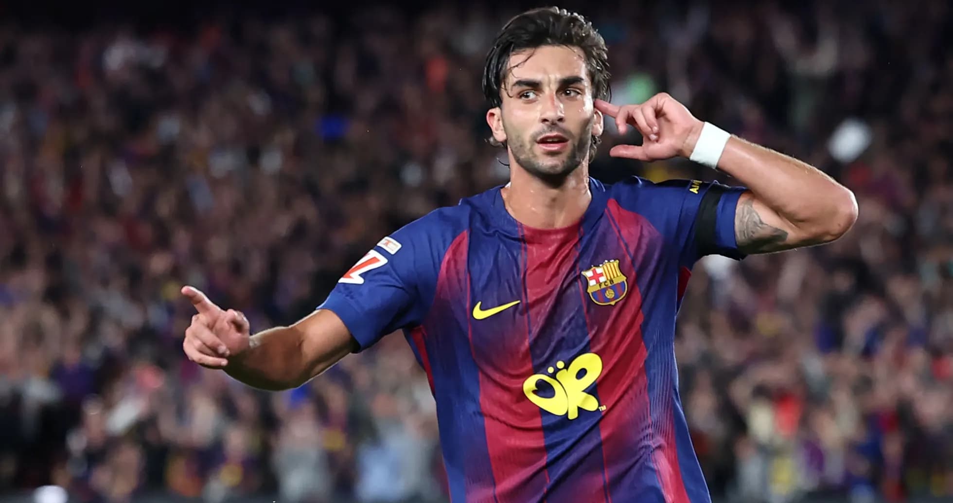 Barcelona player celebrating goal with fans