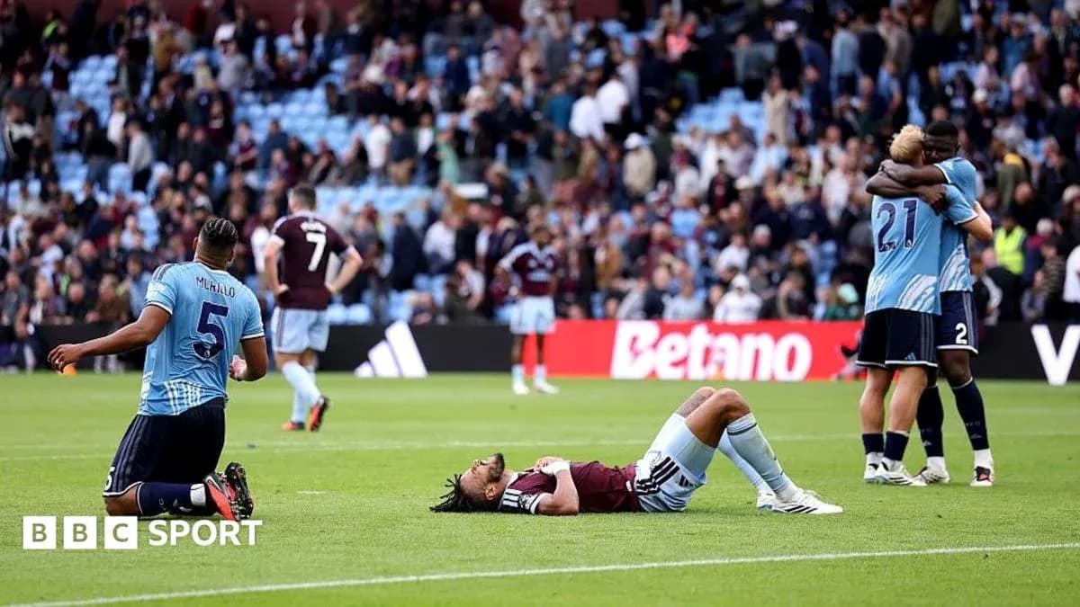 Players reacting after the match, one lying down