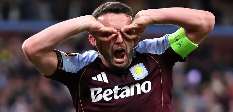 Aston Villa player celebrating with hand gestures