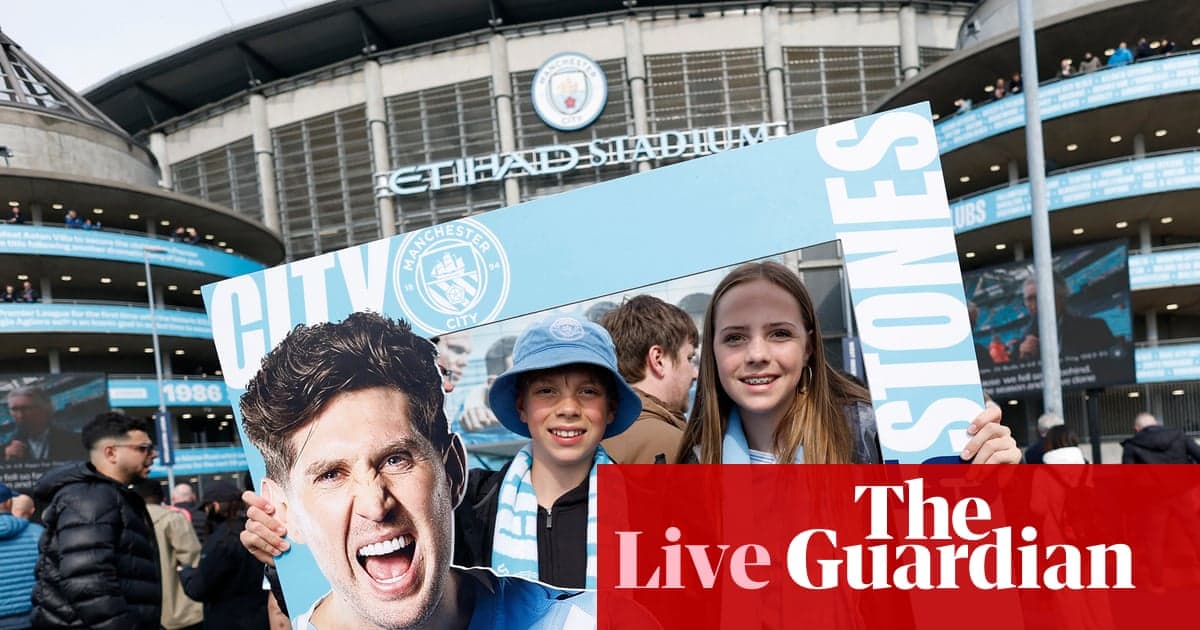 Children holding Manchester City sign outside stadium