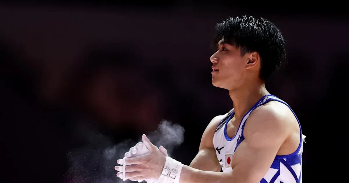 Gymnast applying chalk before performance