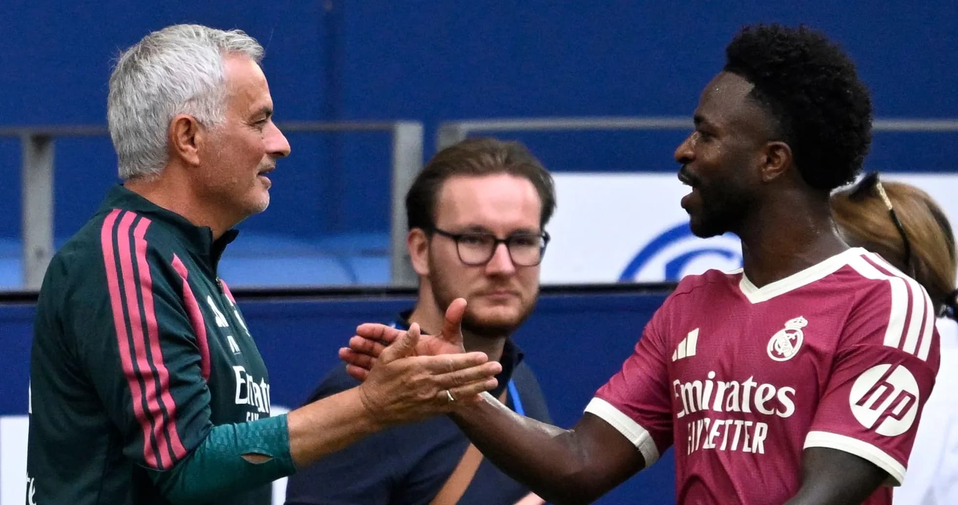 Coach and player shaking hands during training session
