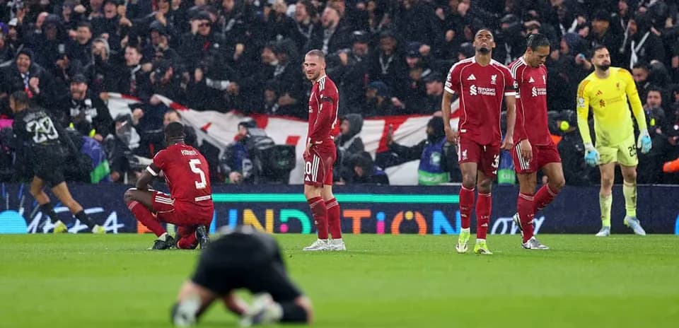 Liverpool players reacting after match defeat