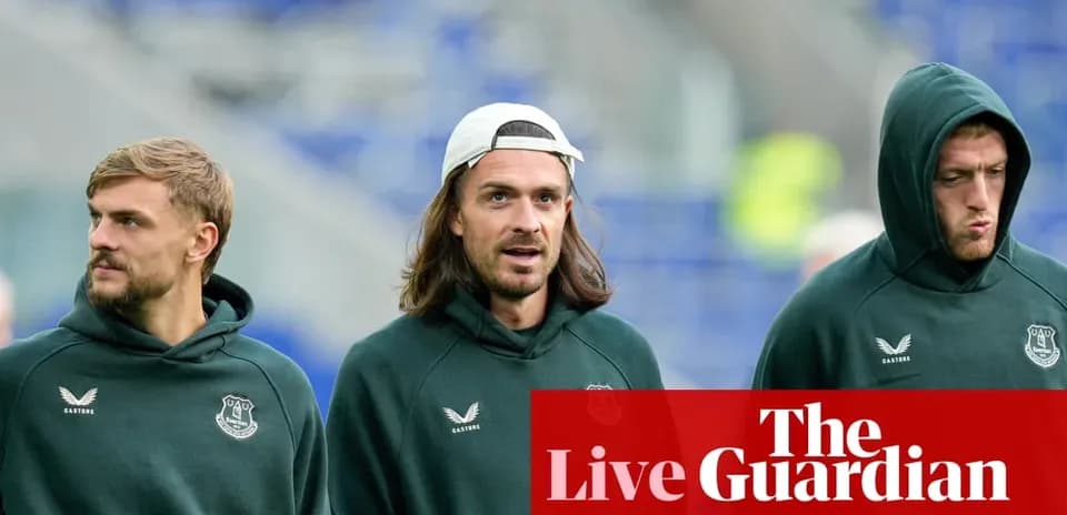 Three players walking in Everton training gear