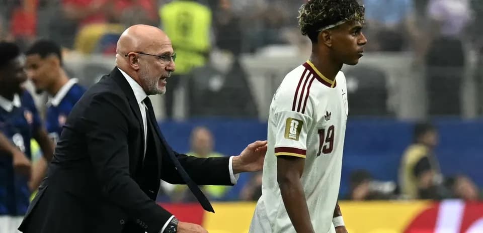 Coach advising player during match on the field