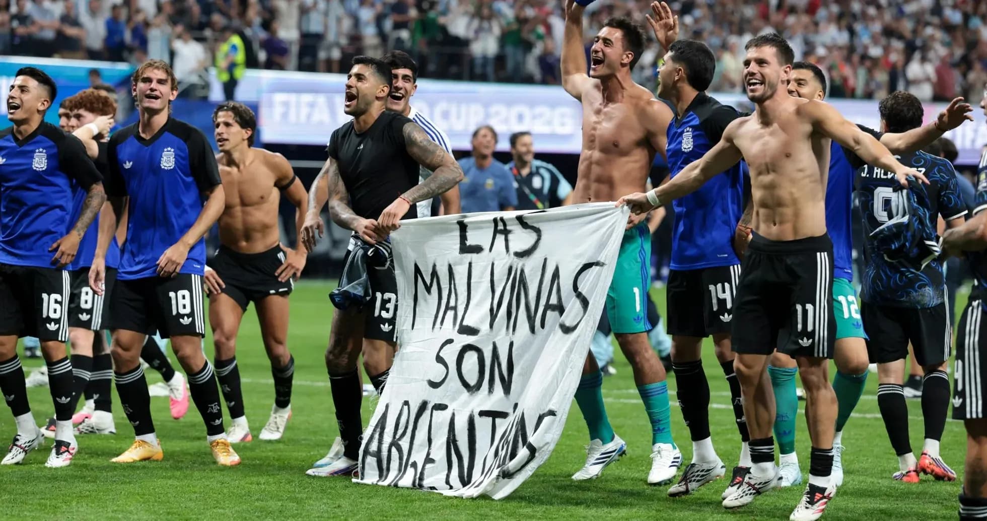 Argentina players celebrating with a banner