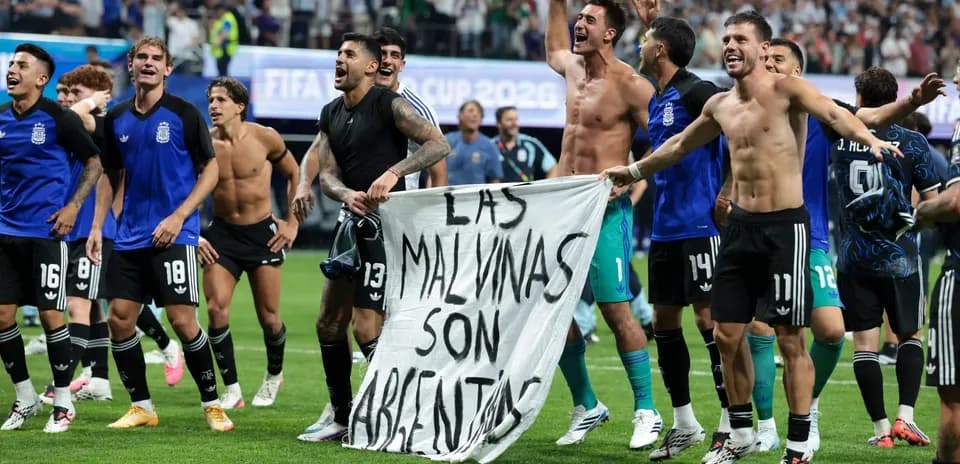 Argentina players celebrating with a banner