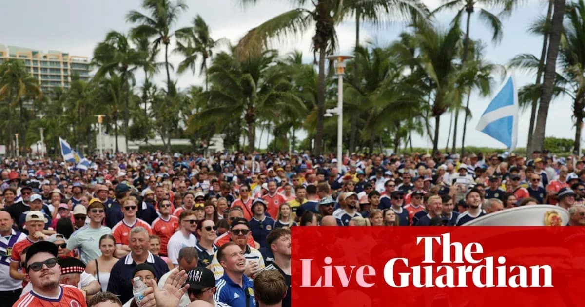 Large crowd of fans at outdoor event with palm trees