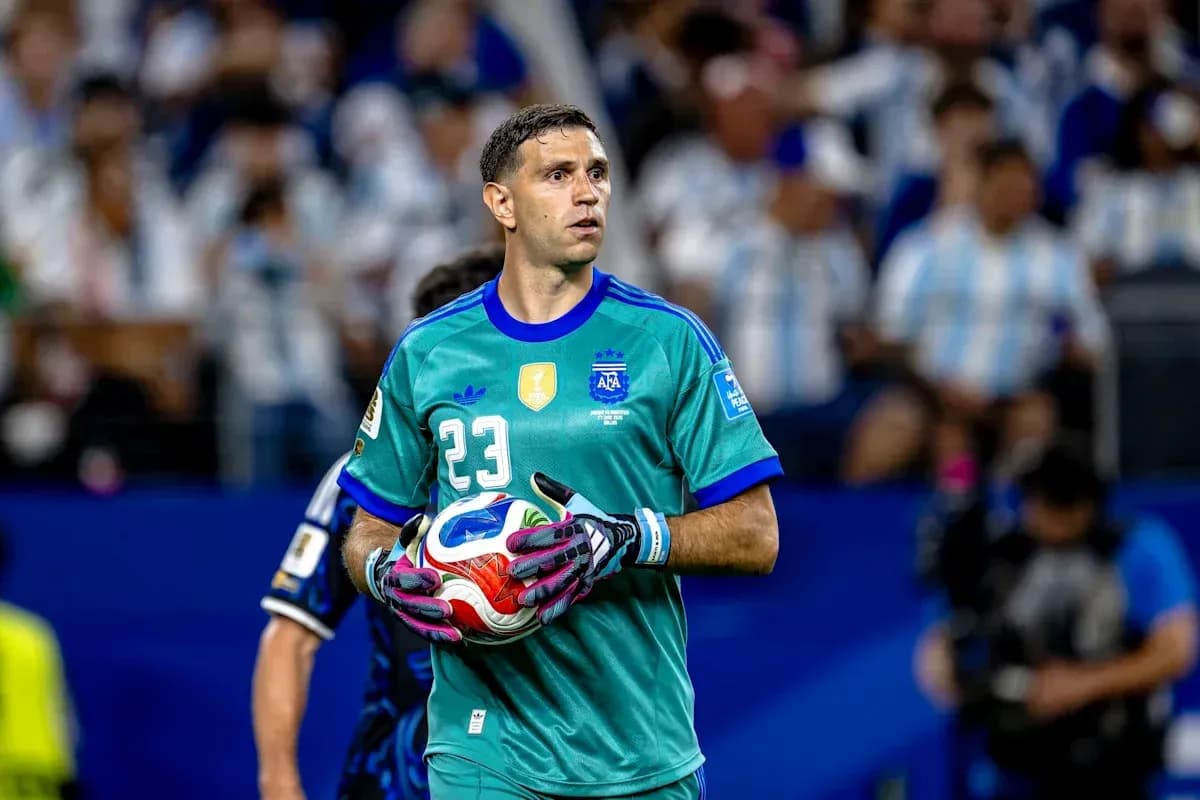 Goalkeeper holding ball during match in stadium