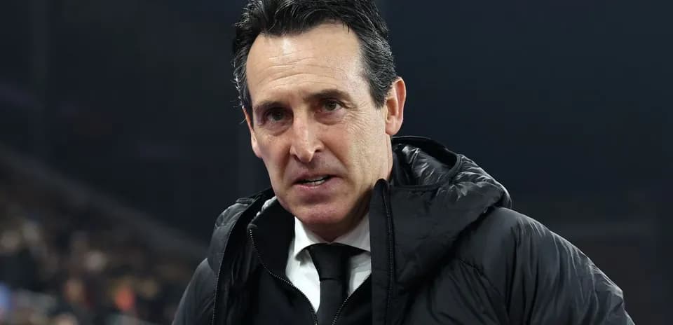 Football manager speaking during match