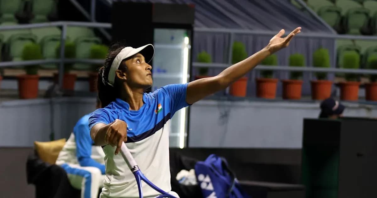 Tennis player serving during practice session