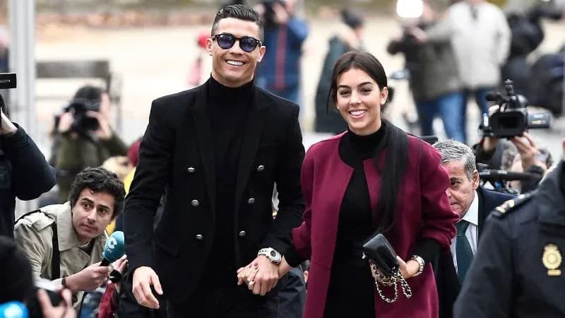 Cristiano Ronaldo and partner walking hand in hand