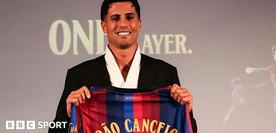 João Cancelo presenting Barcelona jersey at event