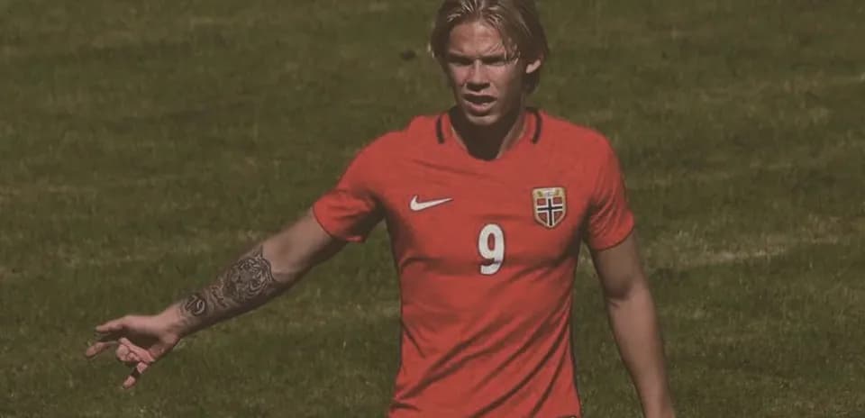 Norwegian player gesturing on the football field