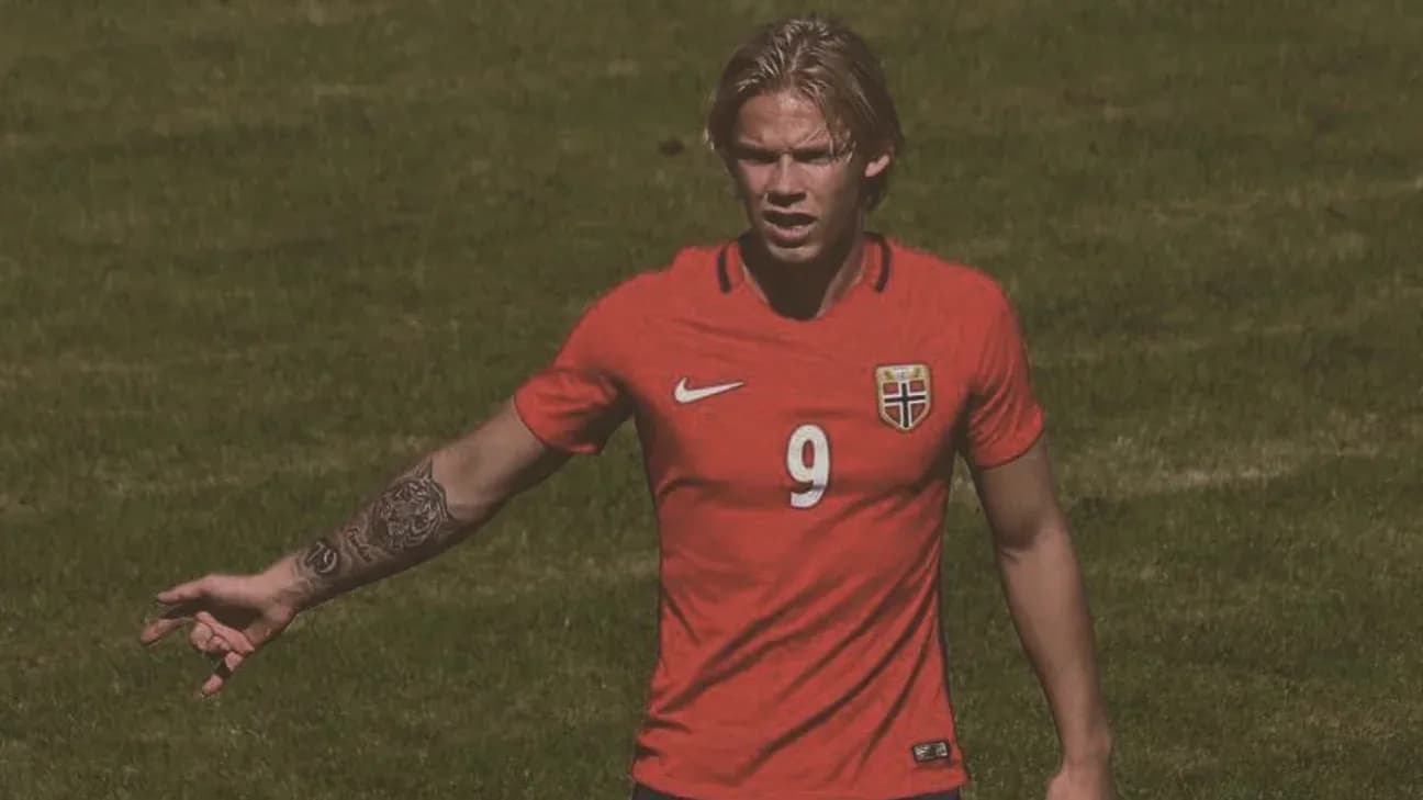 Norwegian player gesturing on the football field