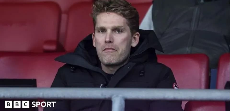 Person seated in stadium watching match