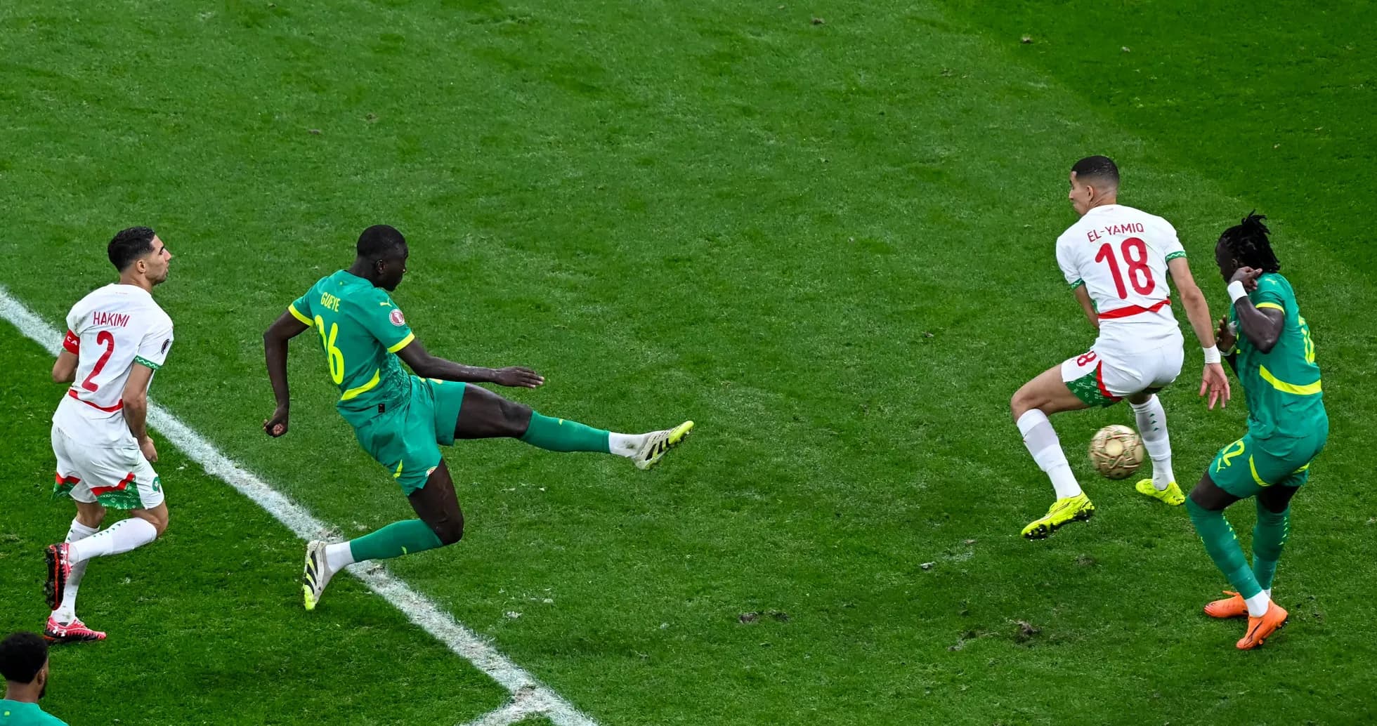 Moroccan players challenging for the ball during match
