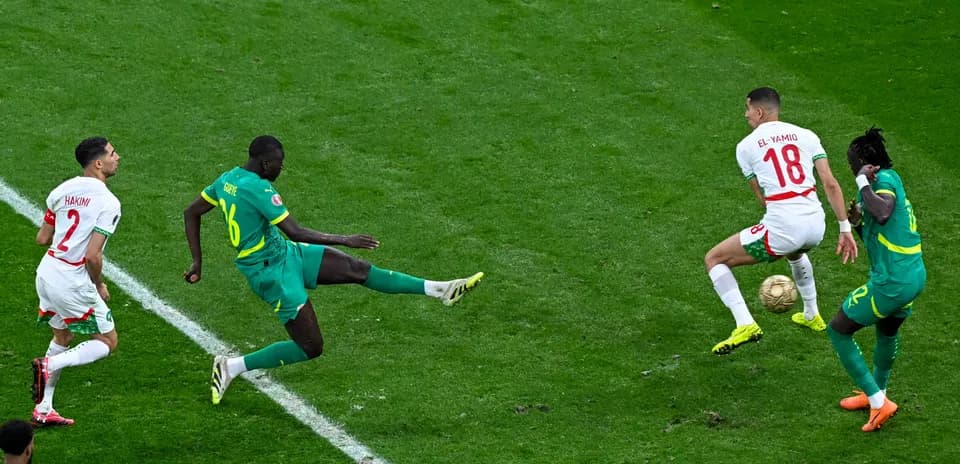 Moroccan players challenging for the ball during match