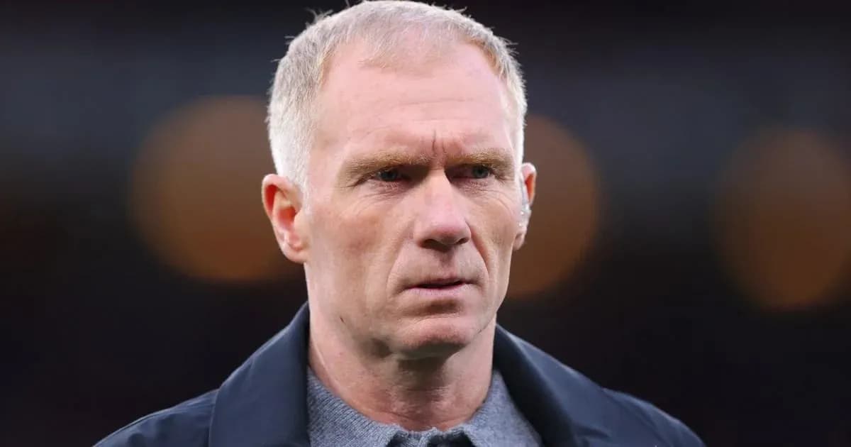 Man in jacket looking focused during match