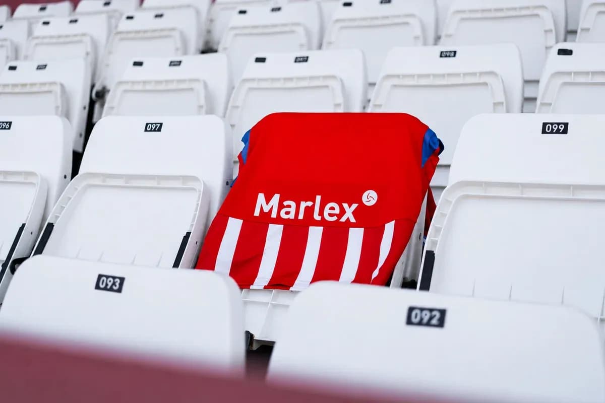 Red and white jersey on empty stadium seat